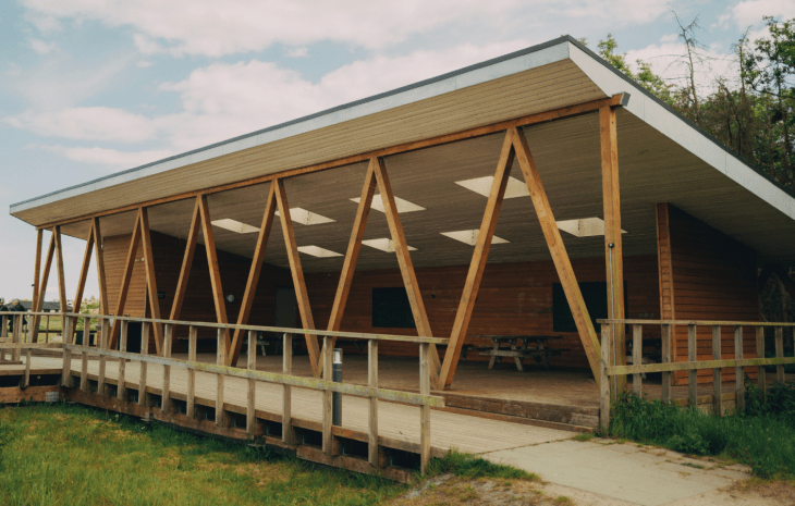 Covered area at Sybergland with surrounding green space.